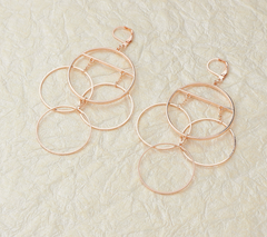 The Claire - Gold Tone Dangle Earrings of Connecting Hoops