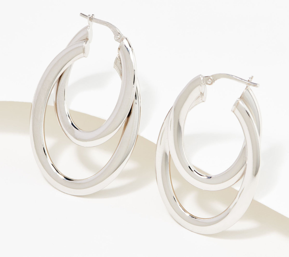 Aros de plata de ley italiana de dos tonos brillantes con doble óvalo. 2,5 cm.